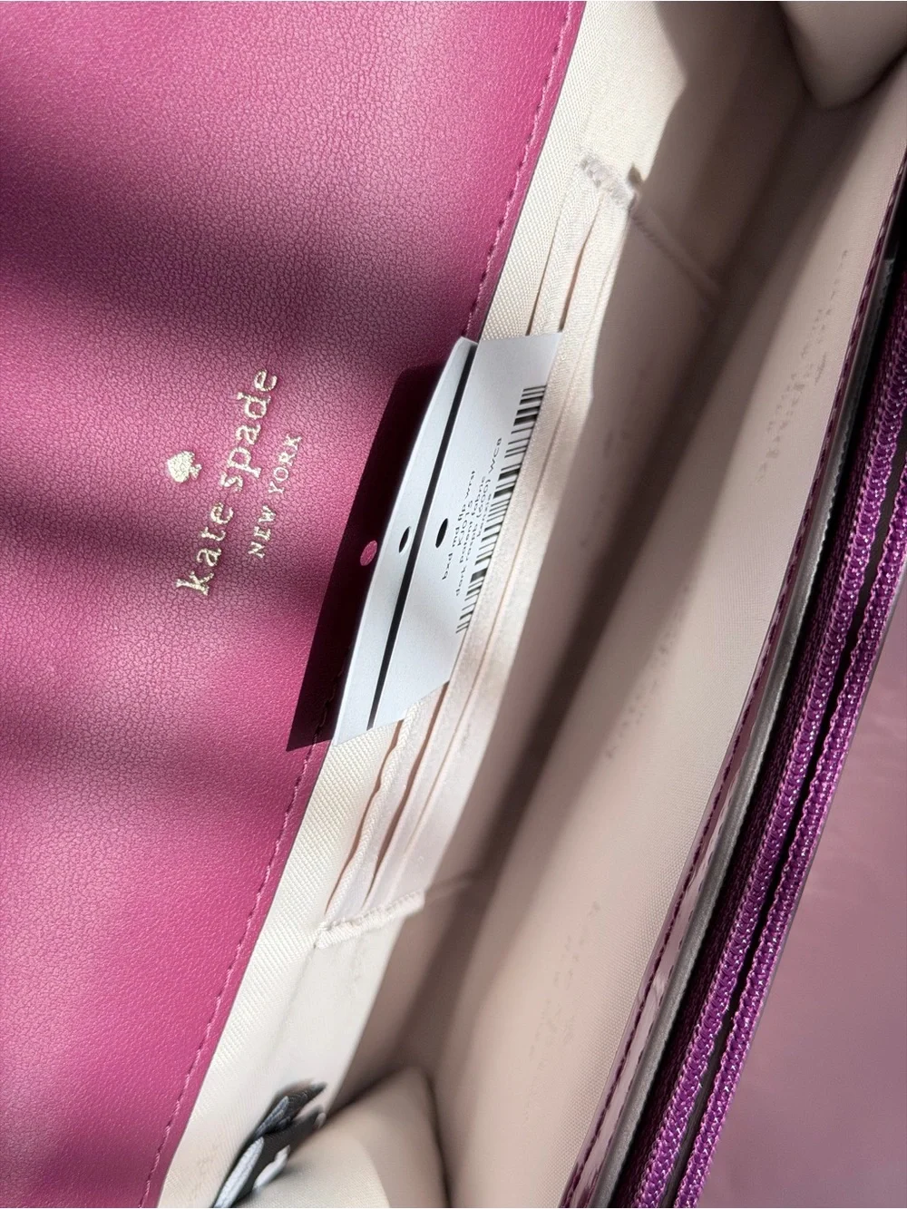 Kate Spade Glossy Magenta Patent Leather Clutch with metal logo plate